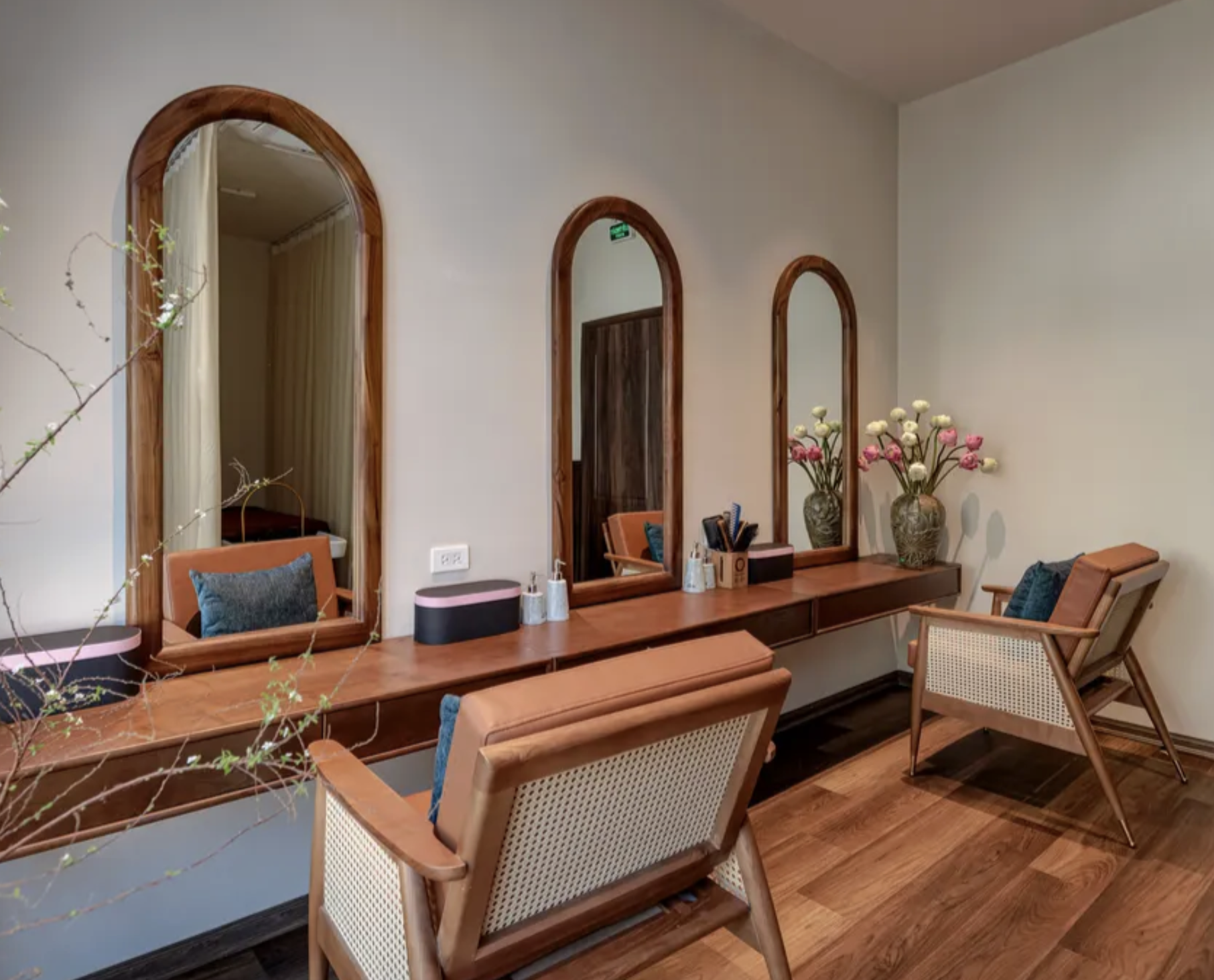 Paz Spa Bali vanity area with wooden mirrors and woven chairs