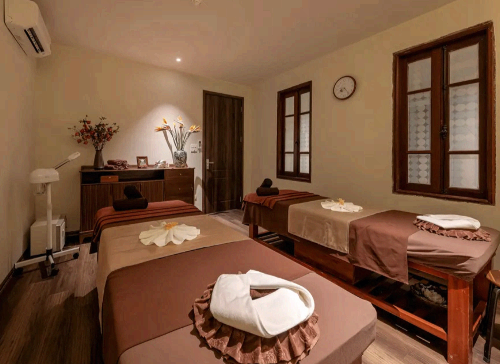Paz Spa Bali treatment room with massage beds and warm ambient lighting
